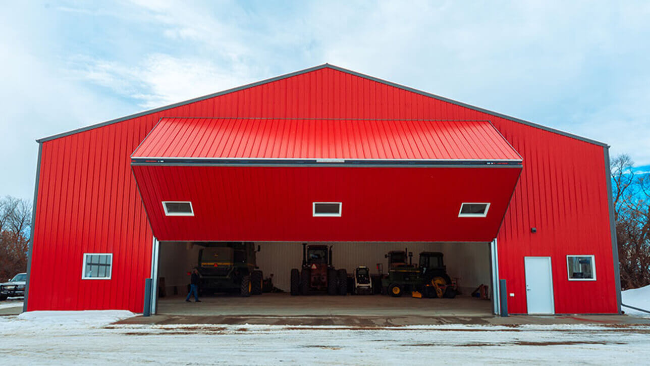 custom-building-shop-bi-fold-front-door-red-beiseker